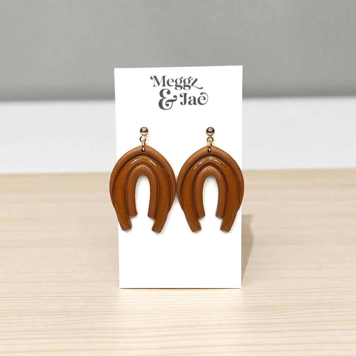 “Audrina” Rust shimmer decorative arch with resin dangles