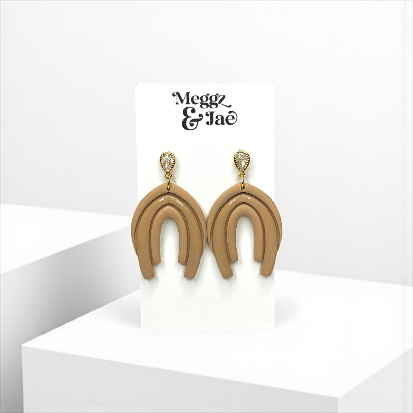 “Abby” Neutral beige arch style dangles with cz topper