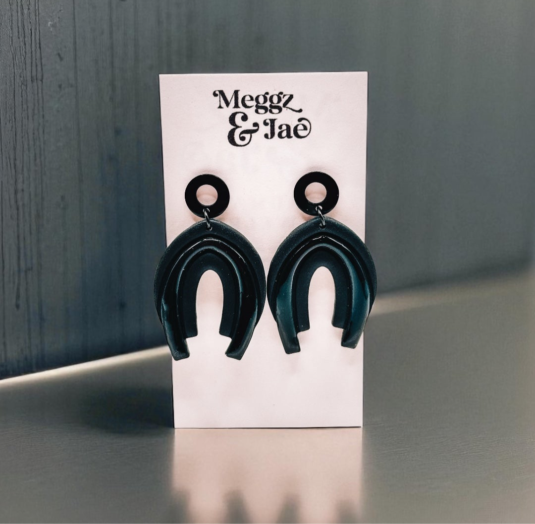 “Serina” black rainbow arch dangles