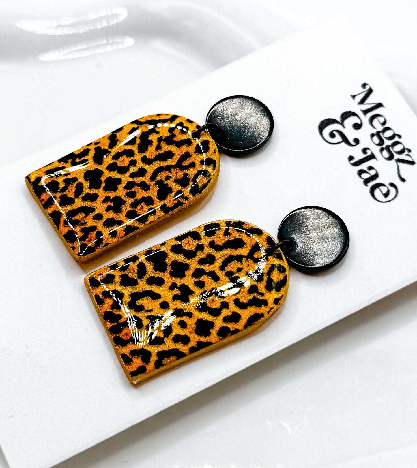 “Missy” shimmer leopard arch dangles
