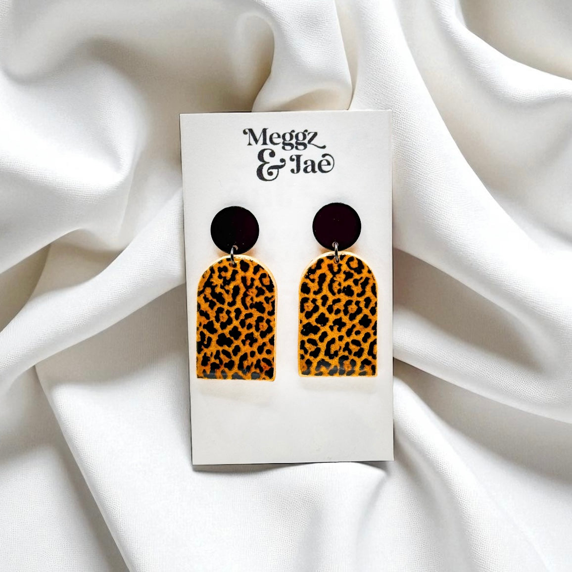 “Missy” shimmer leopard arch dangles