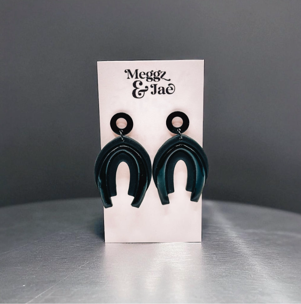 “Serina” black rainbow arch dangles