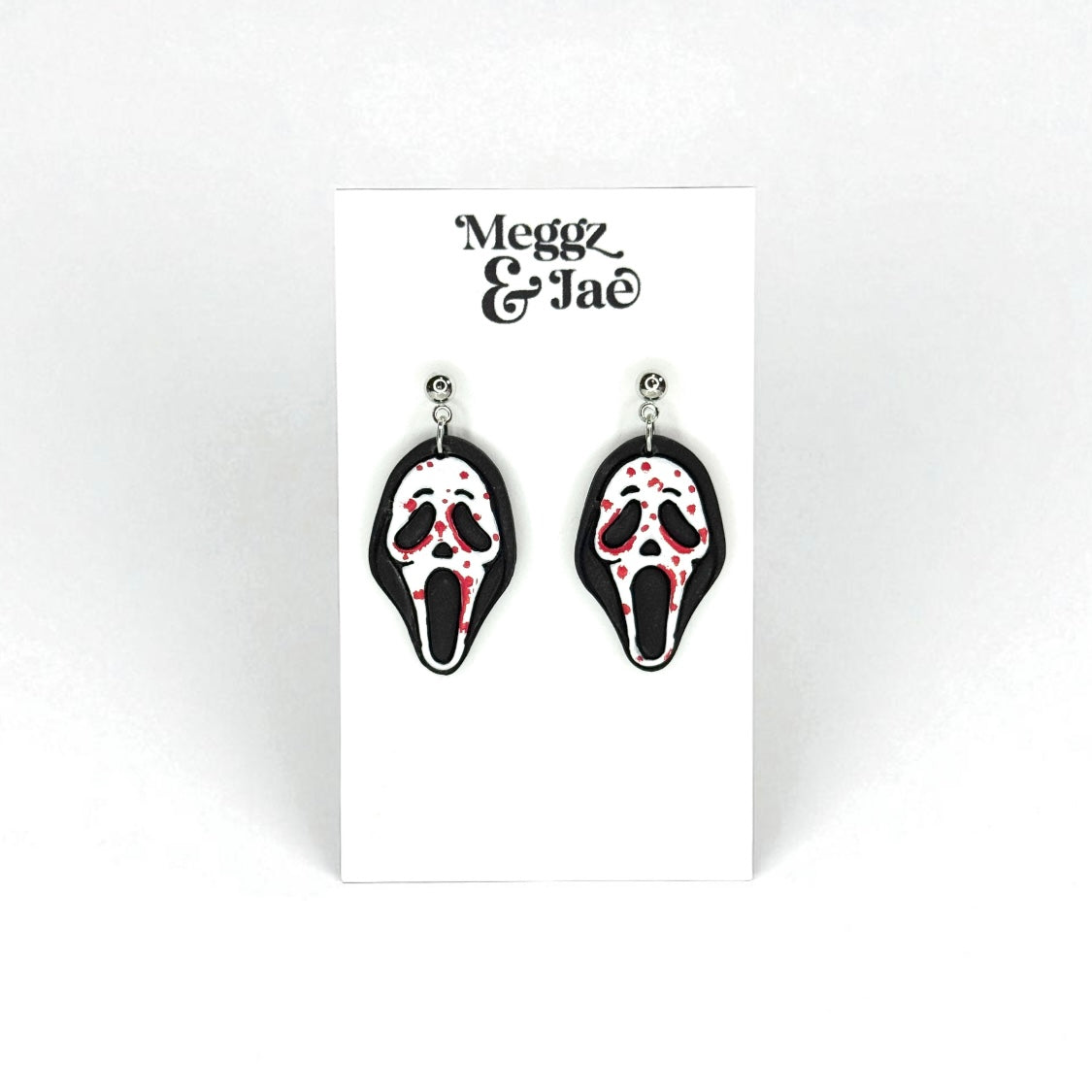 “Scary” movie ghost face polymer clay dangle earrings