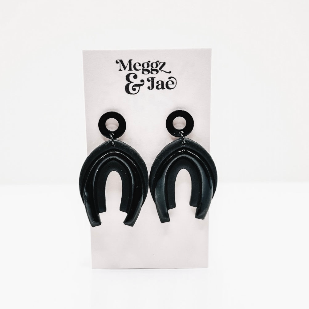 “Serina” black rainbow arch dangles