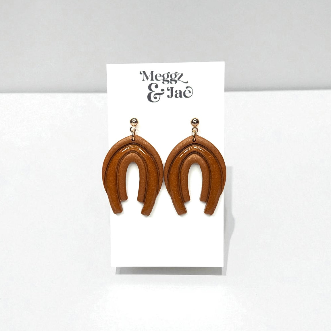 “Audrina” Rust shimmer decorative arch with resin dangles
