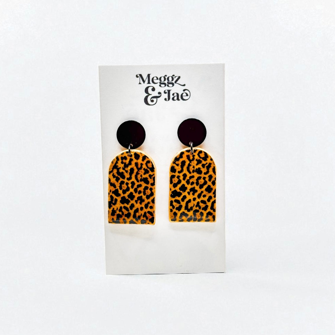 “Missy” shimmer leopard arch dangles