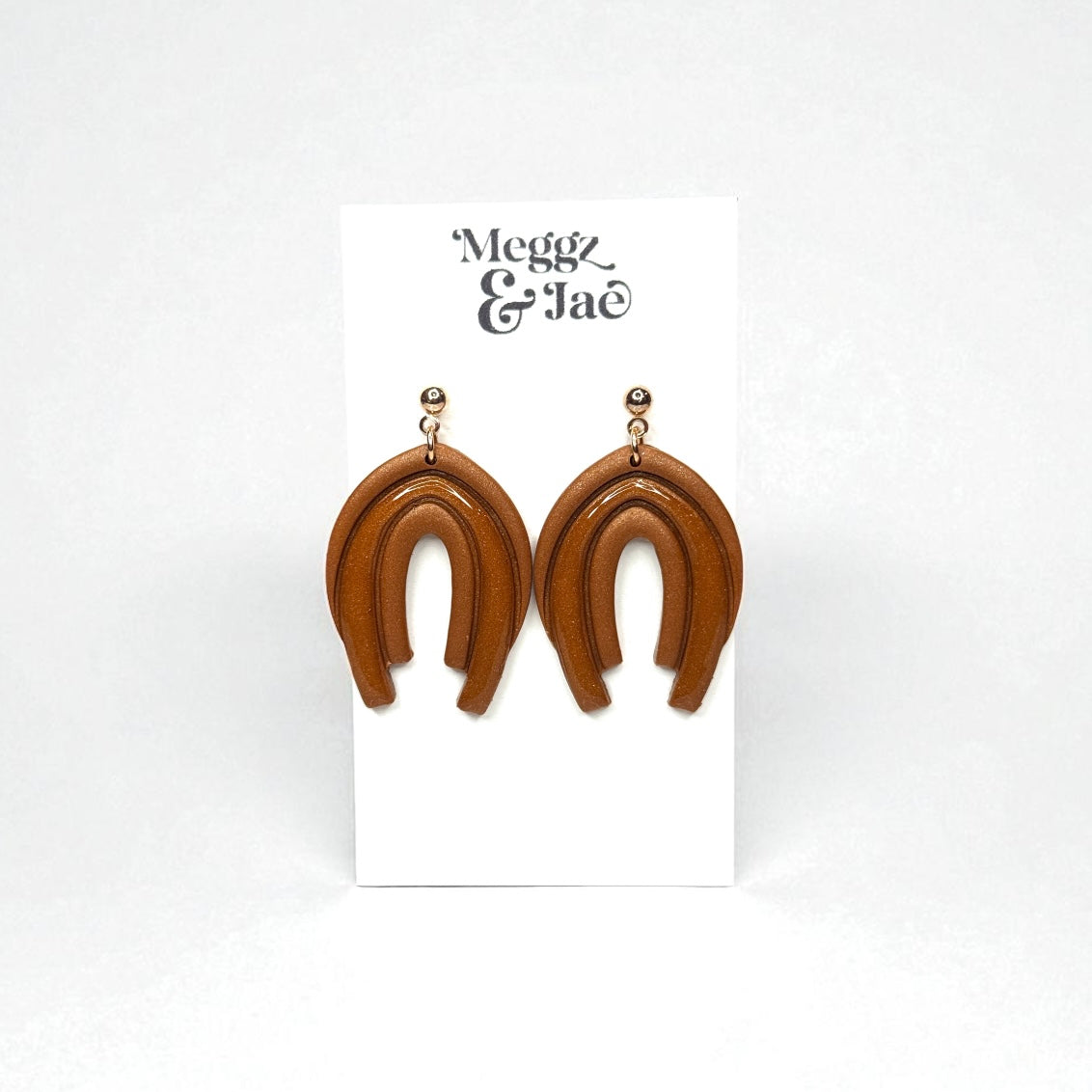 “Audrina” Rust shimmer decorative arch with resin dangles