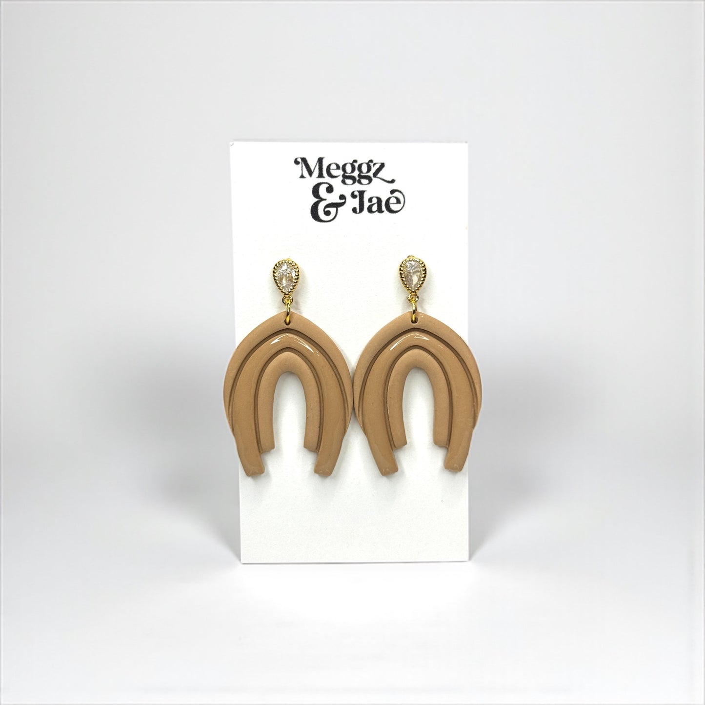 “Abby” Neutral beige arch style dangles with cz topper