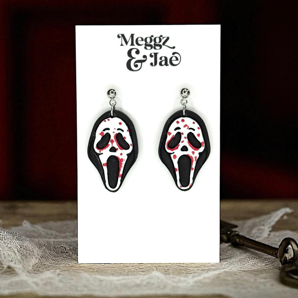 “Scary” movie ghost face polymer clay dangle earrings