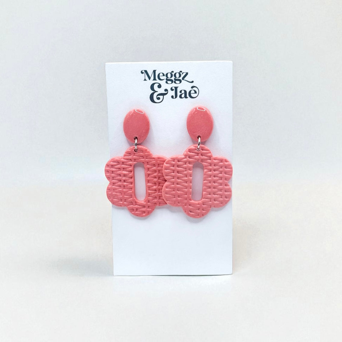 “Cara” pink woven floral shape dangles