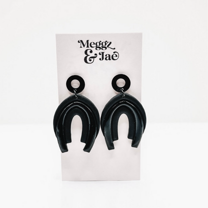 “Serina” black rainbow arch dangles