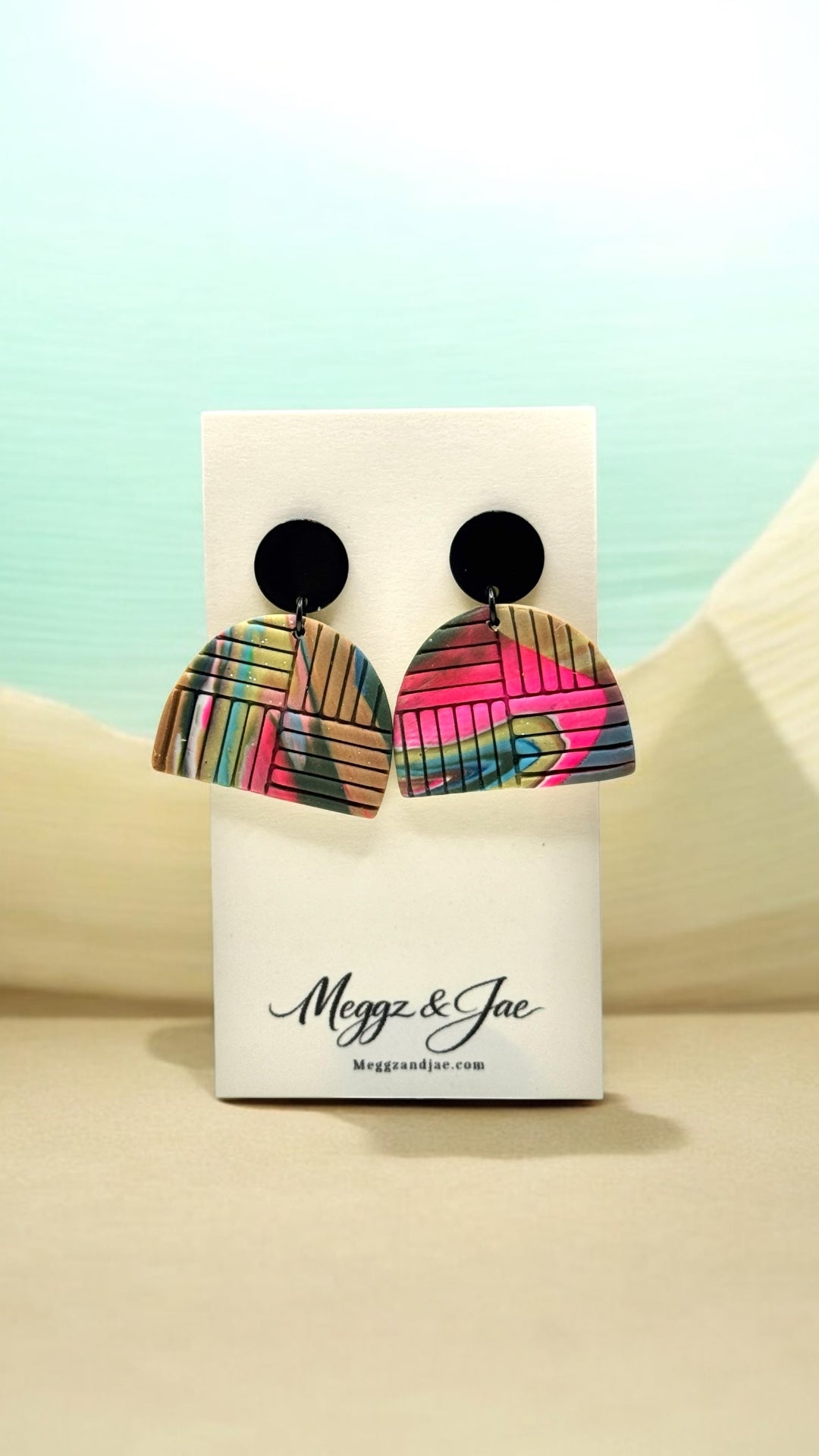 Colorful imprinted polymer clay arch earrings with black metal topper