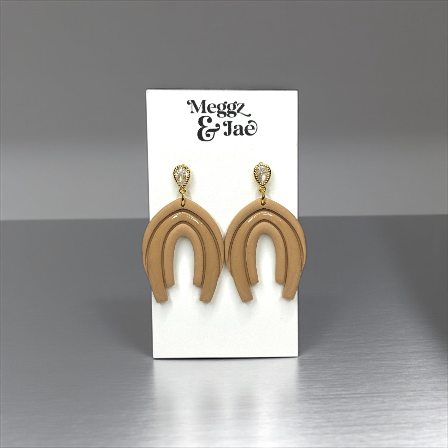 “Abby” Neutral beige arch style dangles with cz topper