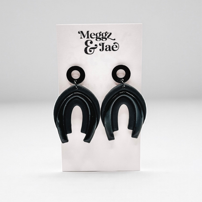 “Serina” black rainbow arch dangles