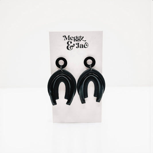 “Serina” black rainbow arch dangles