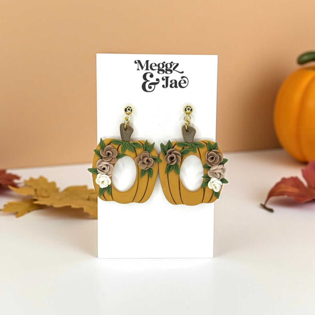 Floral pumpkins with oval cut out polymer clay dangle earrings