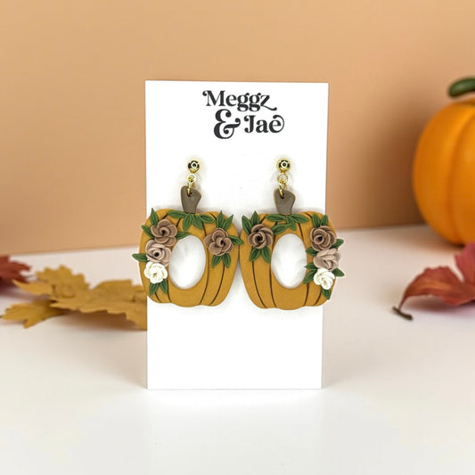 Floral pumpkins with oval cut out polymer clay dangle earrings