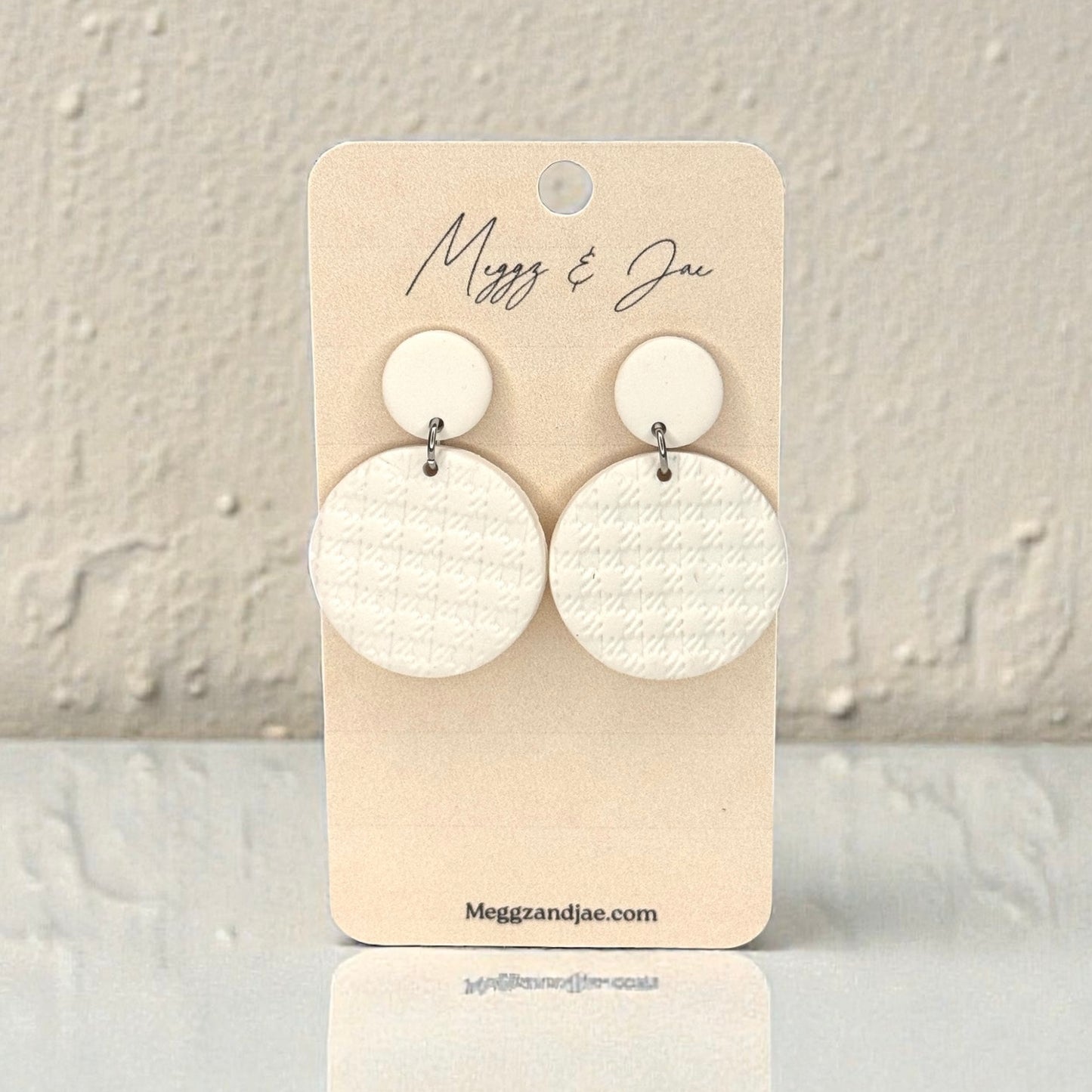 Round white textured polymer clay earrings