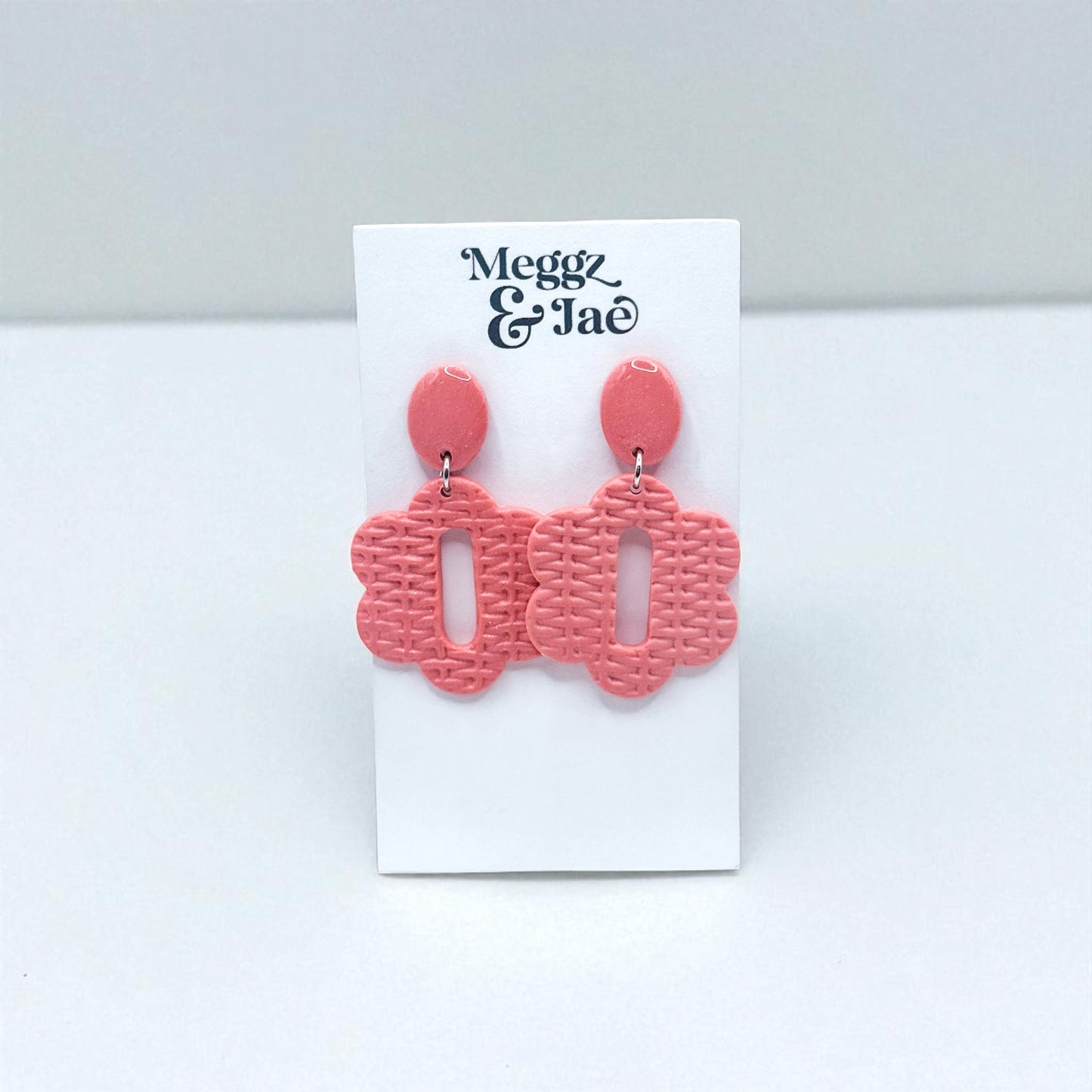 “Cara” pink woven floral shape dangles