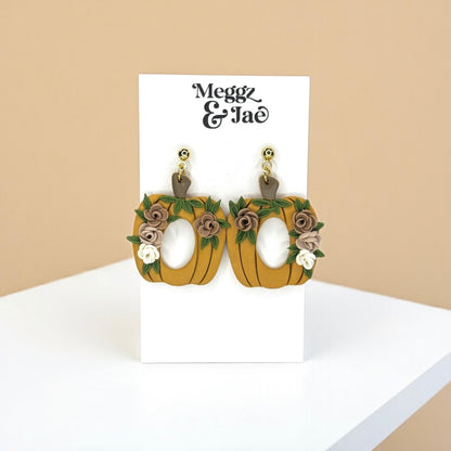Floral pumpkins with oval cut out polymer clay dangle earrings