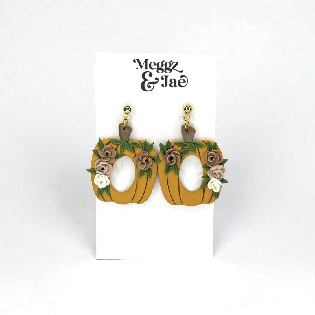 Floral pumpkins with oval cut out polymer clay dangle earrings