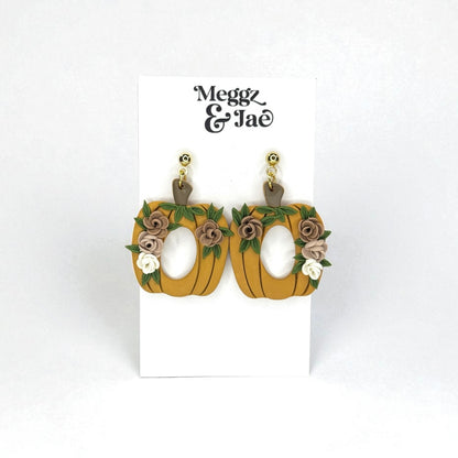 Floral pumpkins with oval cut out polymer clay dangle earrings